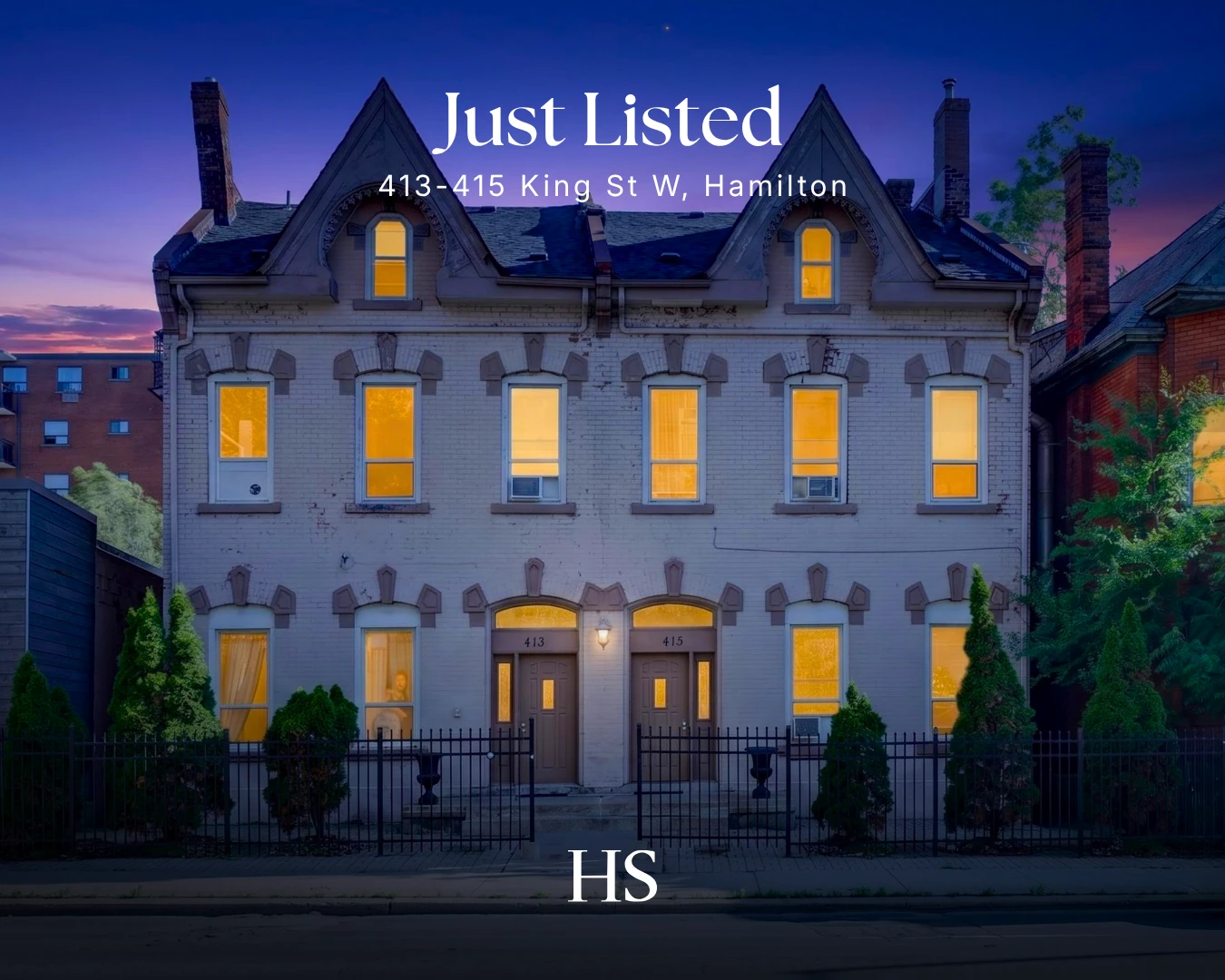 Dusk view of a white-painted Victorian semi with glowing windows, captioned "Just Listed — 413-415 King St W"