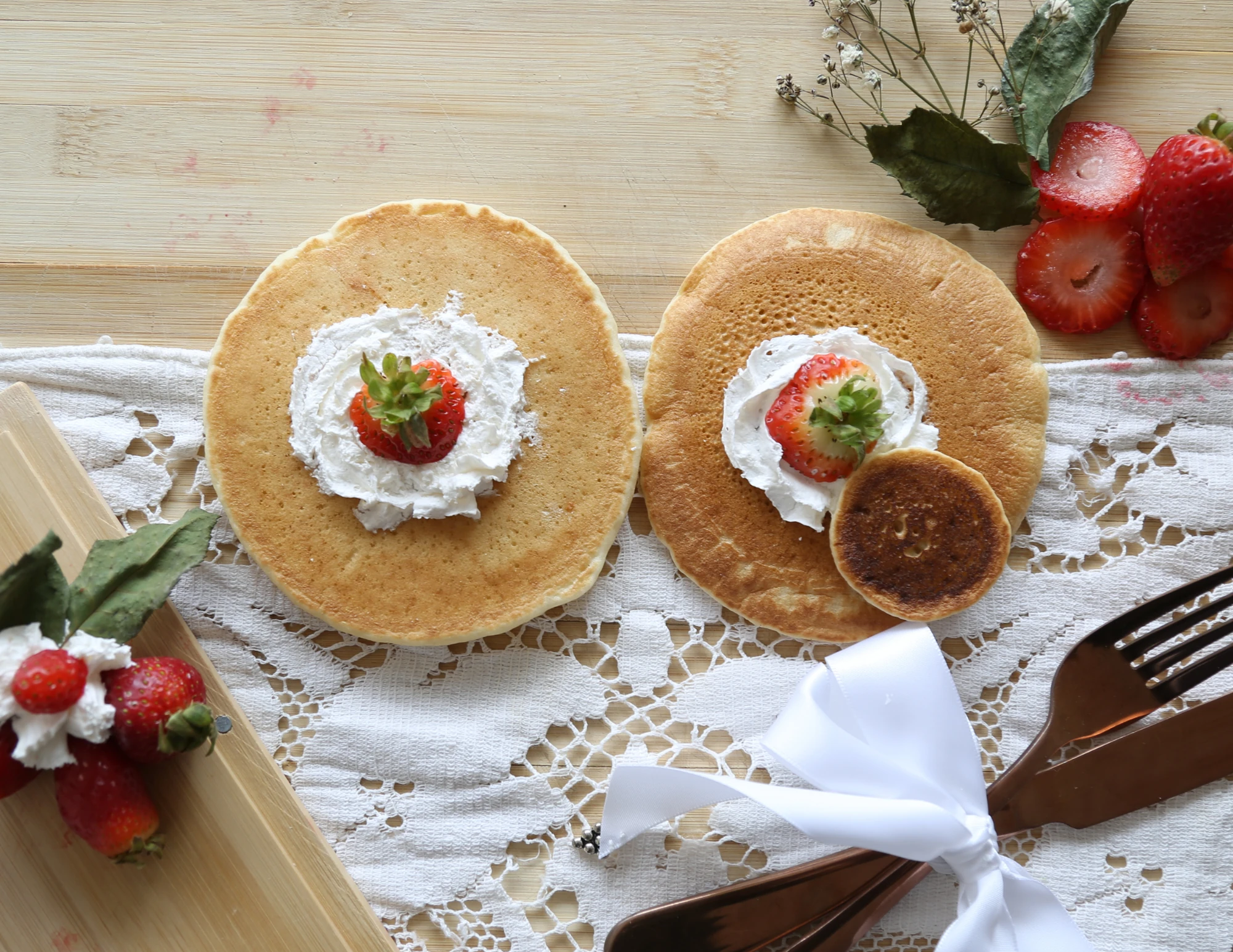 Raw pancake photograph with strawberries, alternate angle